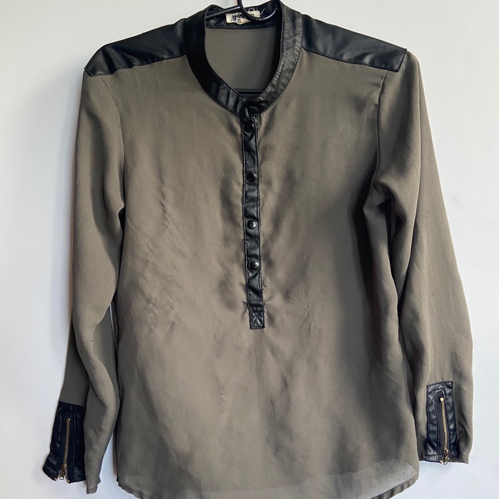 Woman’s blouse with leather shoulders